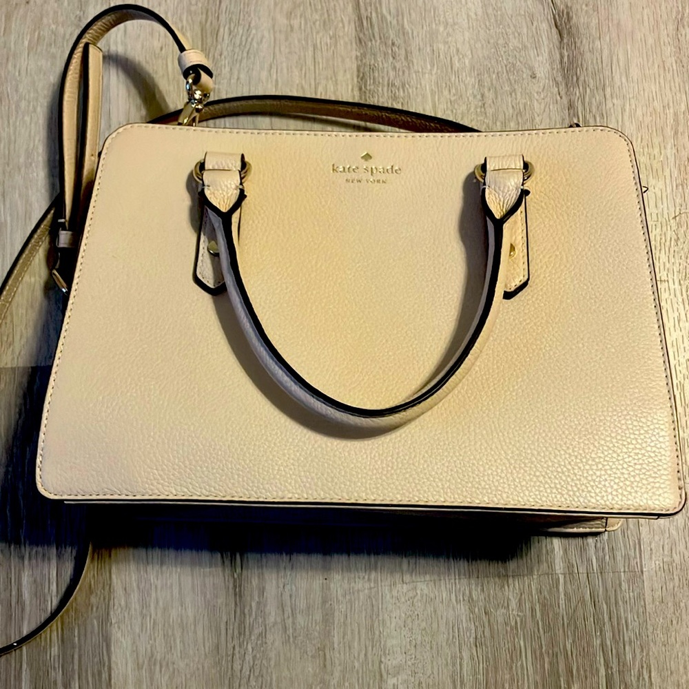 A beautiful rarely used purse with a shoulder strap.